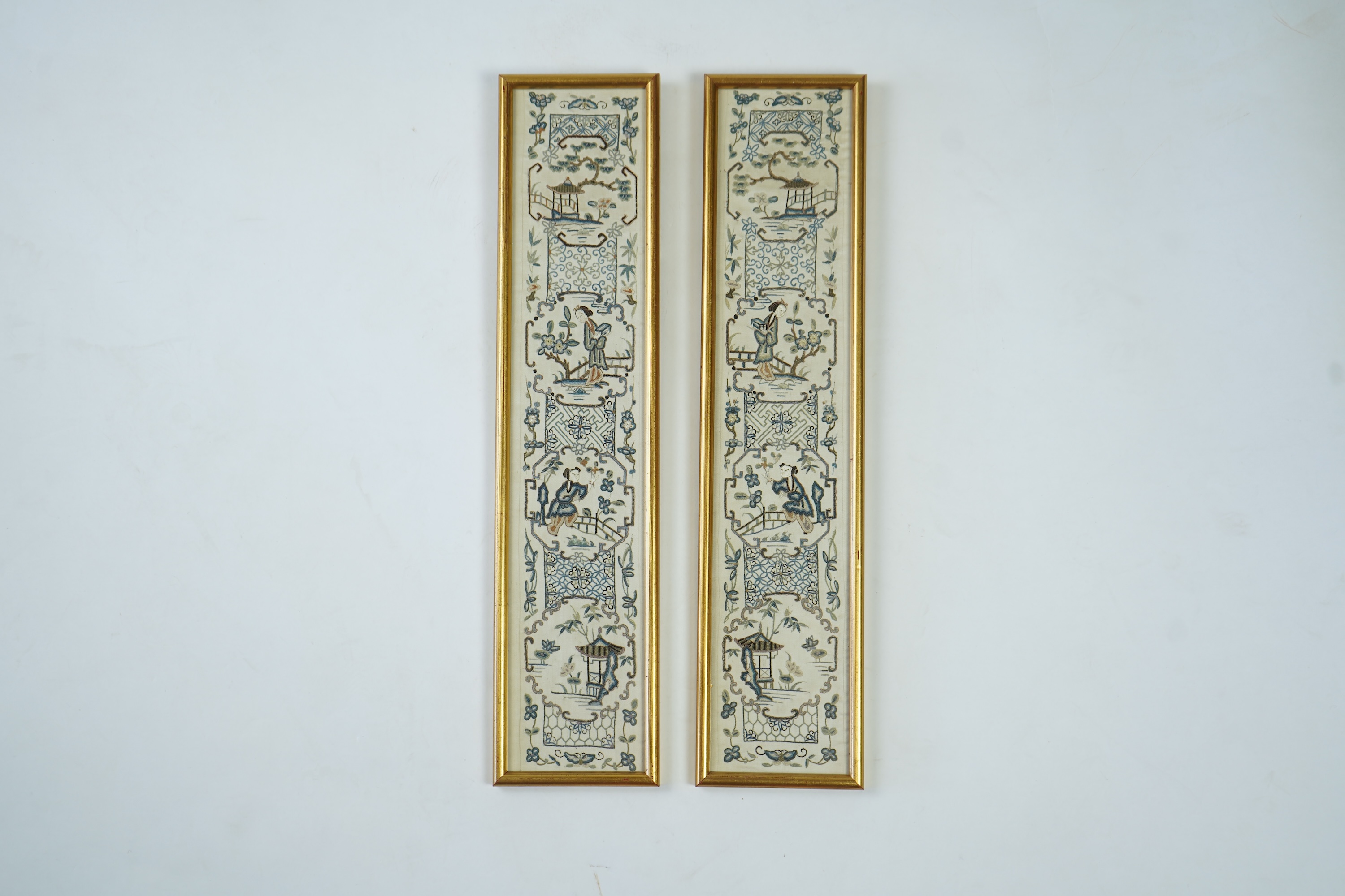 A pair of 19th century Chinese figural silk embroidered sleeve bands. Embroidered in Chinese knot stitch, mostly in blues silk threads on a cream silk backing. 49cm long x 9.5cm wide., Condition - backing fabric and embr